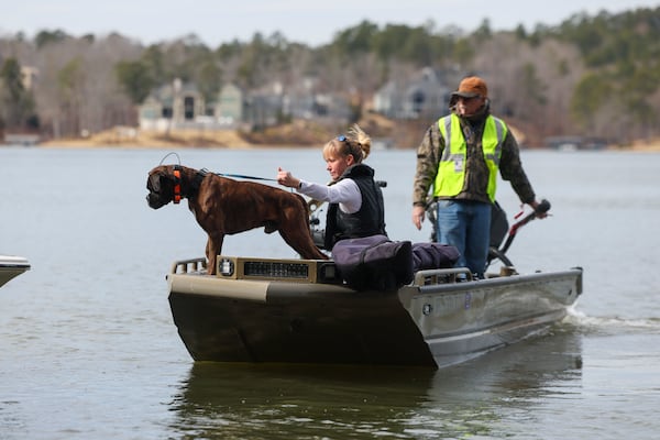 Laurence Walker, a volunteer with the Cajun Navy Relief, right, takes a cadaver dog and the dog’s handler out on Lake Oconee to search for Gary Jones, Tuesday, February, 18, 2025, in Eatonton, Ga. The Putnam County sheriff is investigating and searching after Spelman College instructor Joycelyn Nicole Wilson and an Atlanta private school coach Gary Jones went missing on Lake Oconee over a week ago, Saturday Feb. 8th. The body of Wilson was found Sunday, Feb. 9th and Jones has not been found. (Jason Getz / AJC)