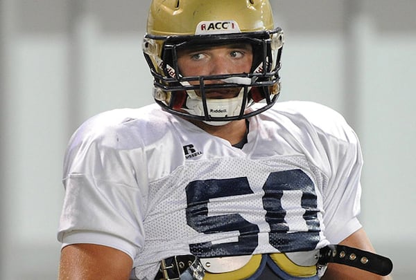 080816 - Atlanta - Offensive lineman Jay Finch (50) holds the football during Georgia Tech football on Tuesday, Aug 16, 2011. Johnny Crawford jcrawford@ajc.com. Former Georgia Tech center Jay Finch is hoping his phone will be ringing draft weekend.