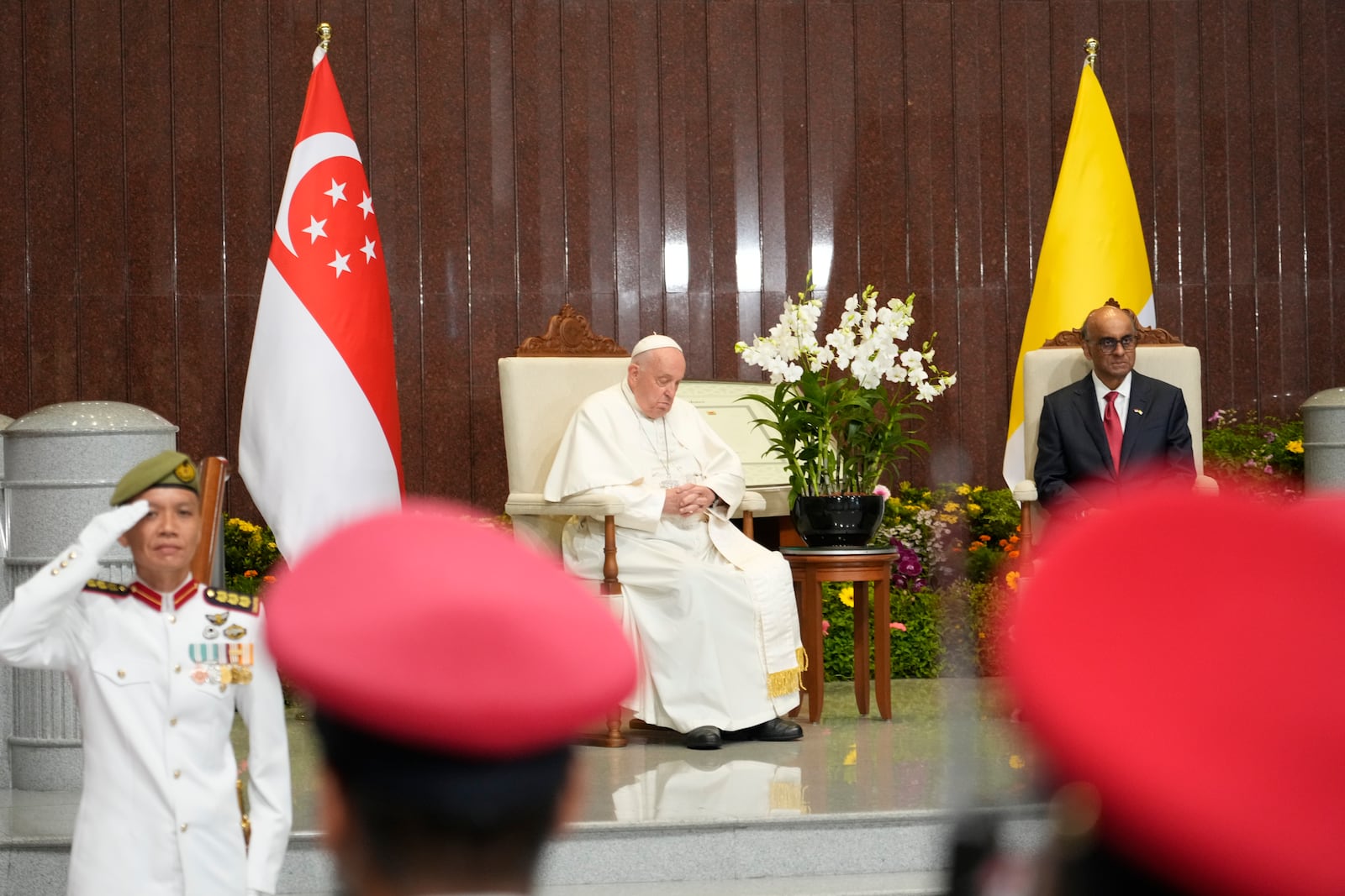 Pope Francis attends a welcome ceremony with the President of the Singapore Republic Tharman Shanmugaratnam, right, at the Parliament House in Singapore, Thursday, Sept. 12, 2024. Pope Francis flew to Singapore on Wednesday for the final leg of his trip through Asia, arriving in one of the world's richest countries from one of its poorest after a record-setting final Mass in East Timor. (AP Photo/Gregorio Borgia)