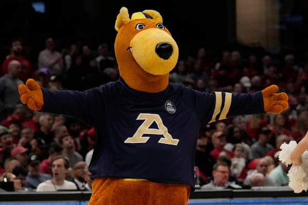 Akron mascot Zippy performs in the first half of an NCAA college basketball game against Miami (Ohio) in the championship of the Mid-American Conference tournament, Saturday, March 15, 2025, in Cleveland, Ohio. (AP Photo/Sue Ogrocki)