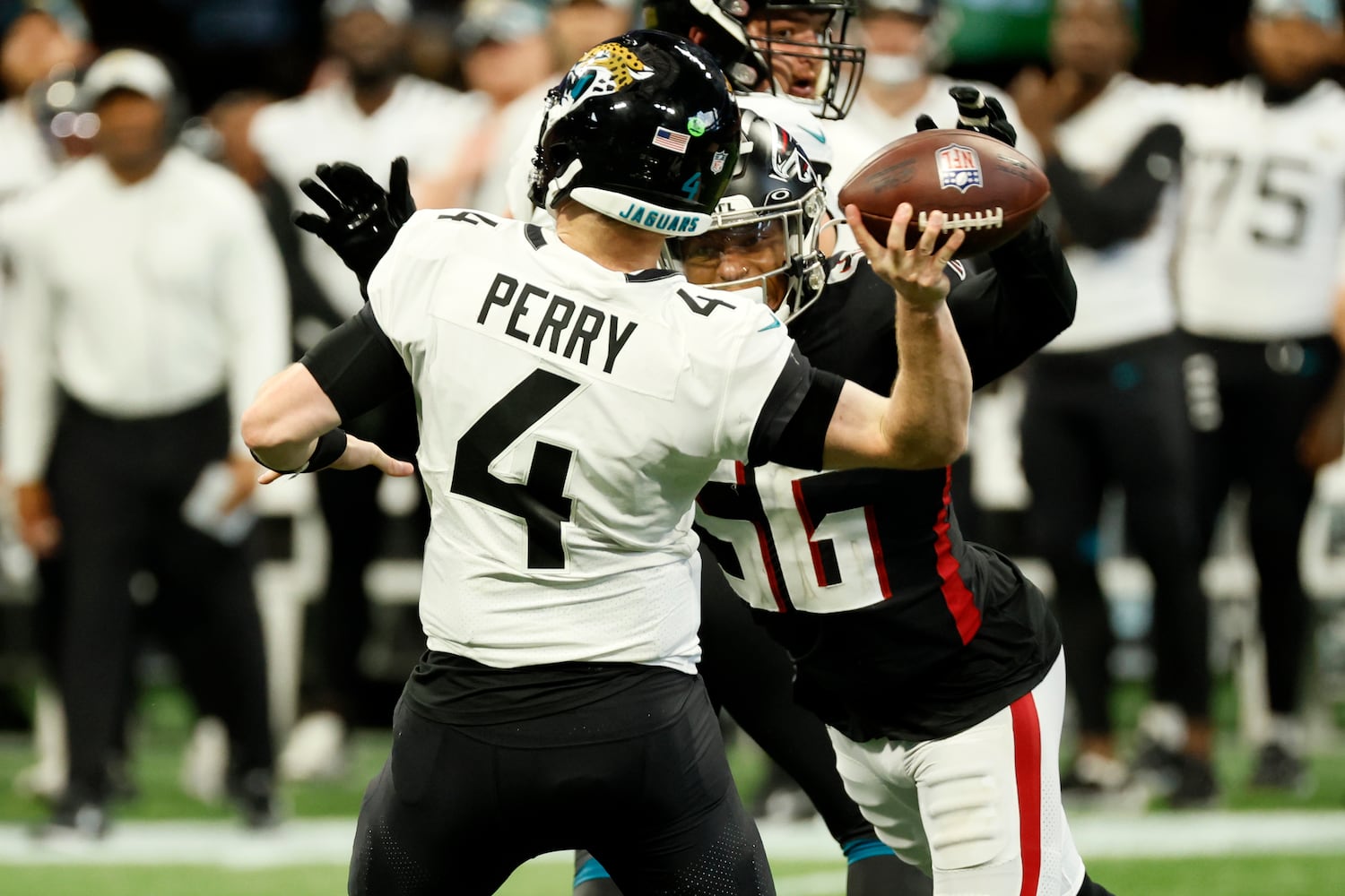 Atlanta Falcons' linebacker Quinton Bell (56) blocks Jacksonville Jaguars' quarterback E.J. Perry (4) during the fourth quarter of an NFL exhibition game against the Jacksonville, Jaguars on Saturday, August 27, 2022, at the Mercedes-Benz Stadium in Atlanta, Ga.
 Miguel Martinez / miguel.martinezjimenez@ajc.com