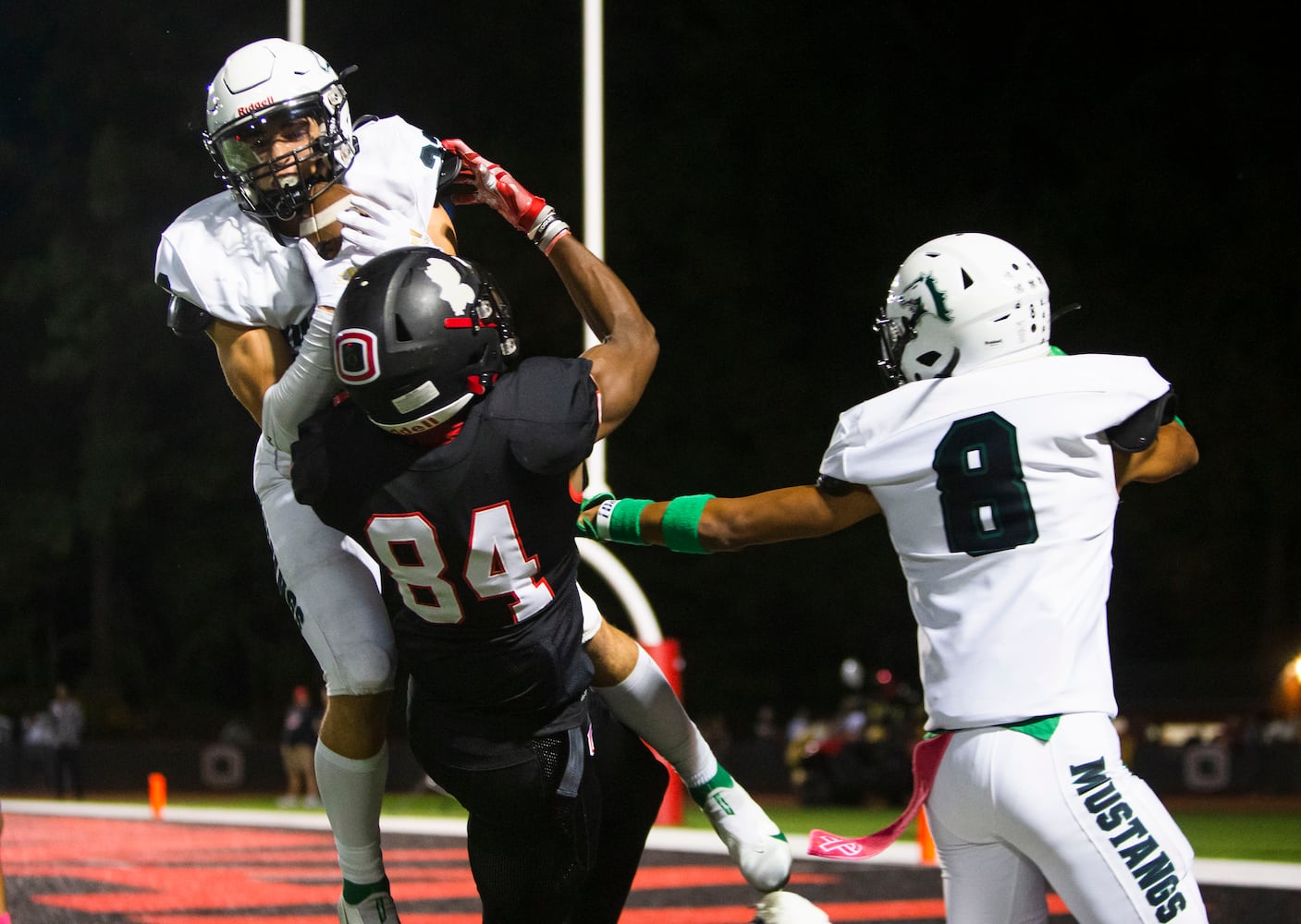 Michael Bell, strong safety for Kennesaw Mountain, makes an interception against Osborne on Friday, October 7, 2022 in Marietta. Kennesaw Mountain defeated Osborne 49-0. CHRISTINA MATACOTTA FOR THE ATLANTA JOURNAL-CONSTITUTION.