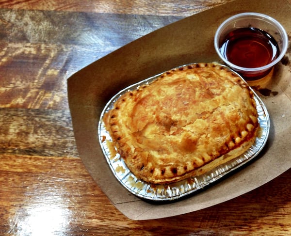 The Southern Breakfast at Panbury’s in Sweet Auburn Curb Market is a pie filled with chicken sausage and scrambled eggs. (Wyatt Williams)