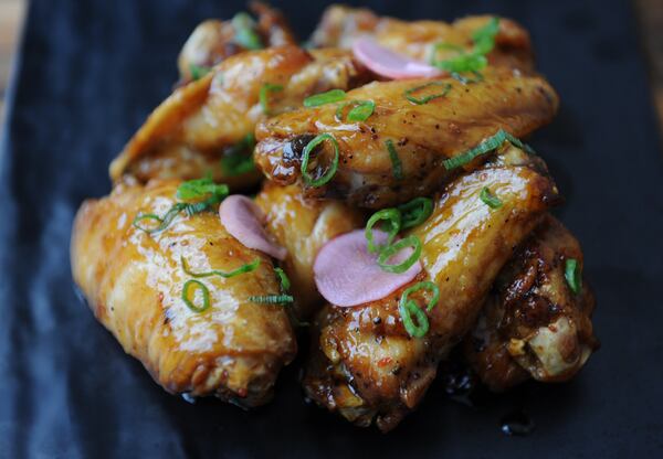 Fish Sauce Caramel Wings with garlic, shallot, palm sugar, fish sauce, butter, Korean chile flake. (BECKY STEIN PHOTOGRAPHY)