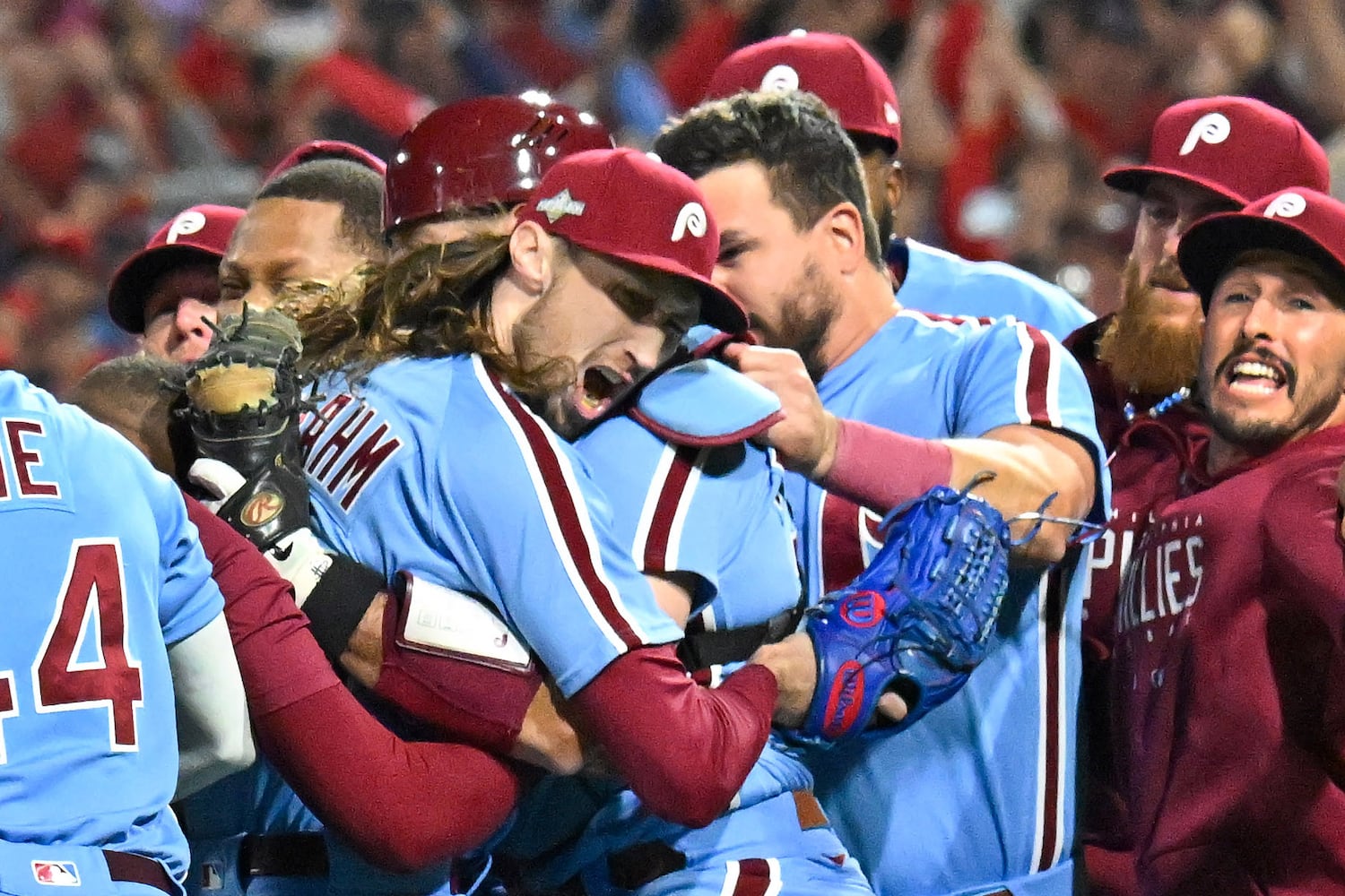 Philadelphia Phillies relief pitcher Matt Strahm, center, celebrates with teammates after a 3-1 NLDS Game 4 win over the Atlanta Braves at Citizens Bank Park in Philadelphia on Thursday, Oct. 12, 2023.   (Hyosub Shin / Hyosub.Shin@ajc.com)