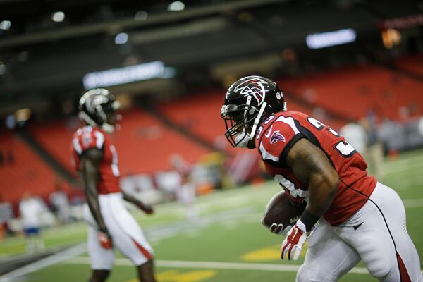 Atlanta Falcons running back Terron Ward (33) works before the first half of an NFL football preseason game between the Atlanta Falcons and the Tennessee Titans, Friday, Aug. 14, 2015, in Atlanta. (AP Photo/David Goldman)