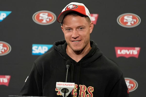 FILE - San Francisco 49ers running back Christian McCaffrey speaks with the media after NFL football practice in Santa Clara, Calif., Tuesday, June 4, 2024. (AP Photo/Tony Avelar, File)