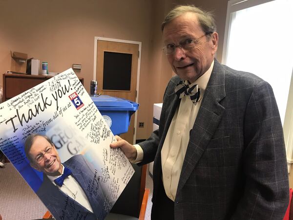 Dick Williams given a thank-you poster from the Fox 5 "Georgia Gang" staff.