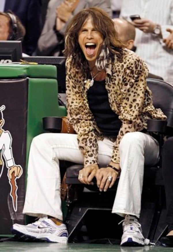 Aerosmith frontman Steven Tyler at an NBA game in 2020. Tyler's Atlanta-based attorney has convinced a New York judge to dismiss historic sexual assault claims against the musician. (Winslow Townson / AP)