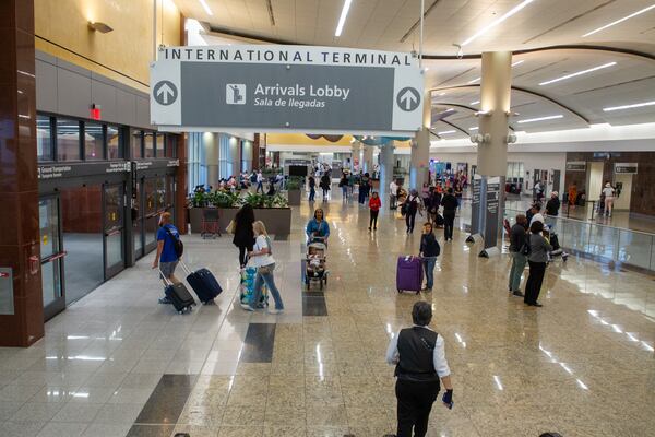 Travelers arrive and depart the international terminal at Hartsfield-Jackson Atlanta Airport Tuesday, May 10, 2022. (Steve Schaefer / steve.schaefer@ajc.com)