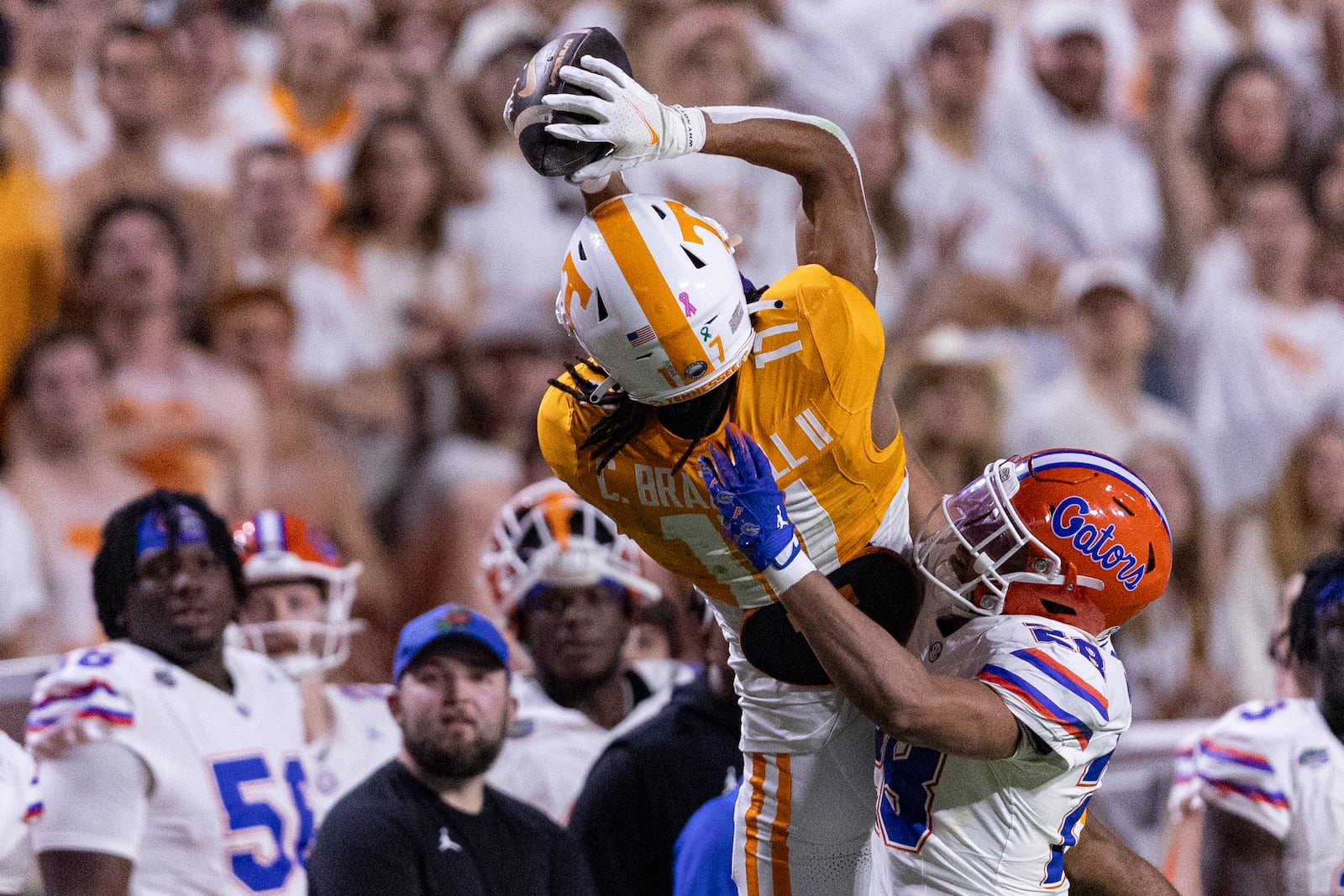 Tennessee wide receiver Chris Brazzell II (17) tries to make a catch as he's defended by Florida defensive back Devin Moore (28)during the second half of an NCAA college football game Saturday, Oct. 12, 2024, in Knoxville, Tenn. (AP Photo/Wade Payne)