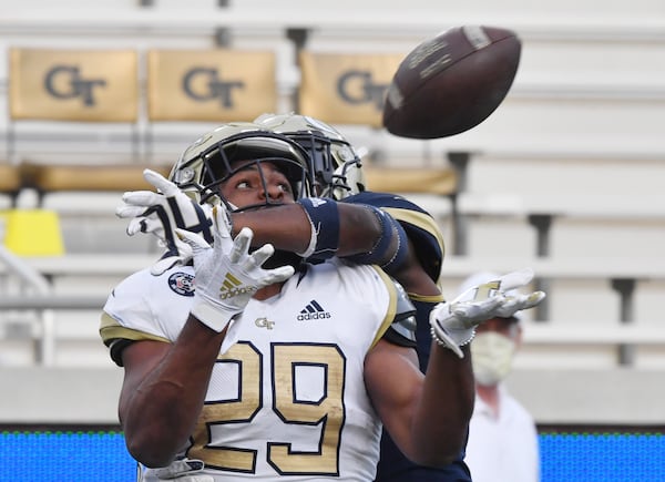 Georgia Tech running back Bruce Jordan-Swilling (29) catches a touchdown pass under pressure from behind by Tech defensive back Zamari Walton (7) during the 2021 spring game at Georgia Tech's Bobby Dodd Stadium in Atlanta on Friday, April 23, 2021. (Hyosub Shin / Hyosub.Shin@ajc.com)