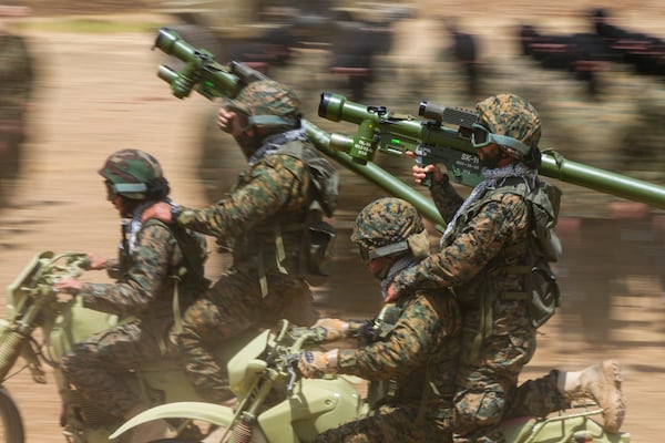 FILE - Fighters from the Lebanese militant group Hezbollah train in southern Lebanon, May 21, 2023. (AP Photo/Hassan Ammar, File)