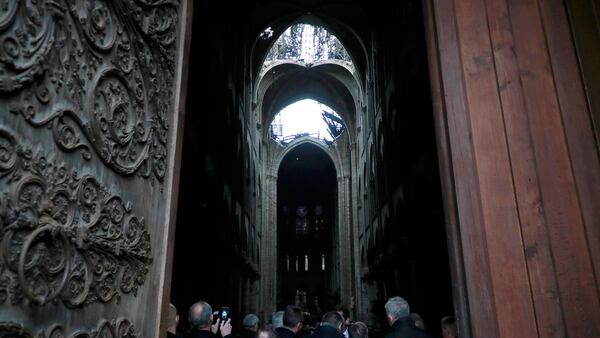 A hole is seen in the dome inside Notre cathedral in Paris, Tuesday, April 16, 2019. Firefighters declared success Tuesday in a more than 12-hour battle to extinguish an inferno engulfing Paris' iconic Notre Dame cathedral that claimed its spire and roof, but spared its bell towers and the purported Crown of Christ.