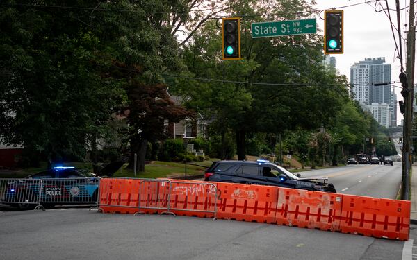 Atlanta Police vehicles block 10th street at State Street on Thursday, June 27, 2024 (Ben Hendren for the Atlanta Journal Constitution)