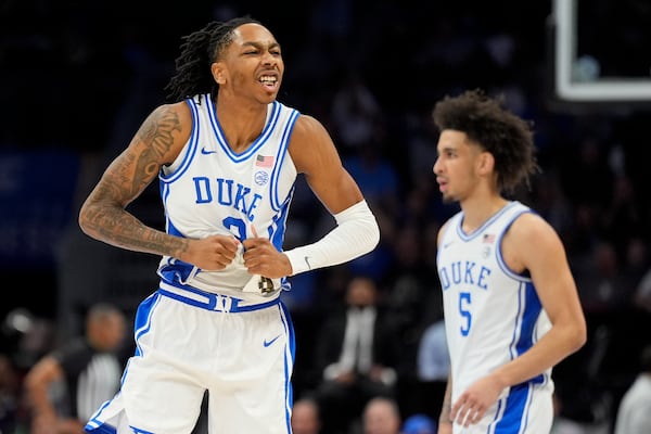 Duke guard Isaiah Evans celebrates after scoring against Georgia Tech during the second half of an NCAA college basketball game in the quarterfinals of the Atlantic Coast Conference tournament, Thursday, March 13, 2025, in Charlotte, N.C. (AP Photo/Chris Carlson)