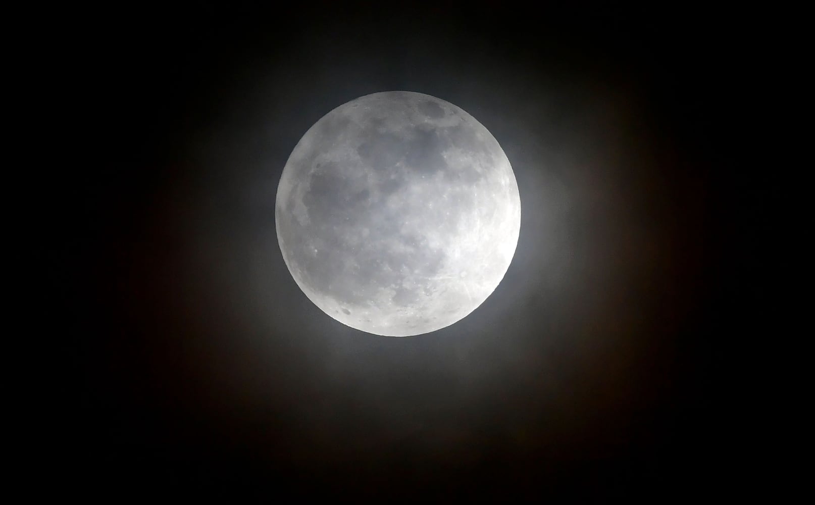 Photos: December full moon, the last of the decade, lights up the night sky