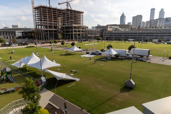 Revel XP workers set up tents at the Home Depot Backyard in preparation for the UGA Chick-fil-A kickoff game at Mercedes Benz Stadium Saturday, September 2, 2022.  Steve Schaefer/steve.schaefer@ajc.com)
