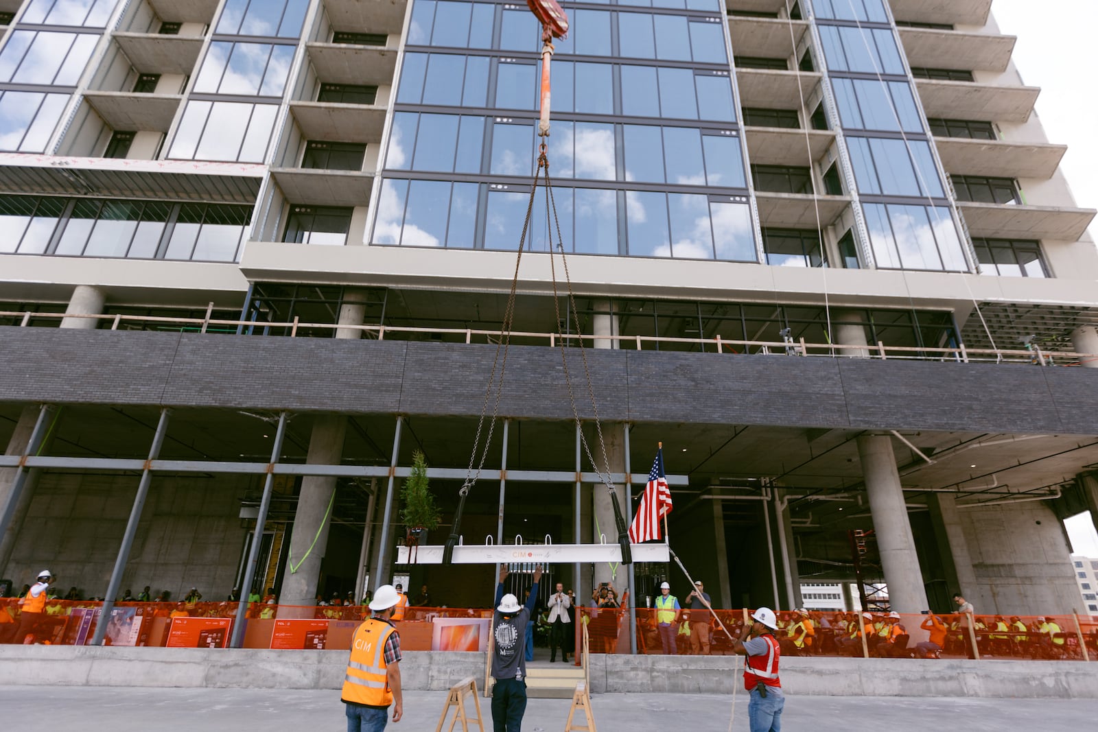 Crews lift a beam during the "topping out" ceremony for a 19-story apartment tower now called the Mitchell within the Centennial Yards development in downtown Atlanta. The August ceremony marked the tower reaching its highest point.