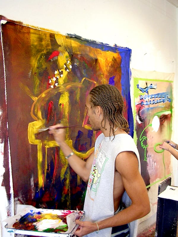 Javier McIntosh, now a senior at Stockbridge High School, is a talented artist who was picked to be in the 2006 Governor's Honors Program. The program was begun by Margaret Bynum, one of the three people being honored as a Georgia Woman of History. He is shown painting at Valdosta State University last summer, where the program was held. credit: Governors Honors Program