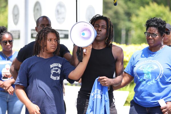 Danzel Smith (20), the son of Danyel Smith, gives a speech during the "Justice for Danyel Smith" rally outside the Gwinnett Justice Administration Center on Thursday, May 5th, 2022. "It's been 20 years without birthdays, Christmas, and graduations without him, and I miss him," Smith said. Miguel Martinez /miguel.martinezjimenez@ajc.com