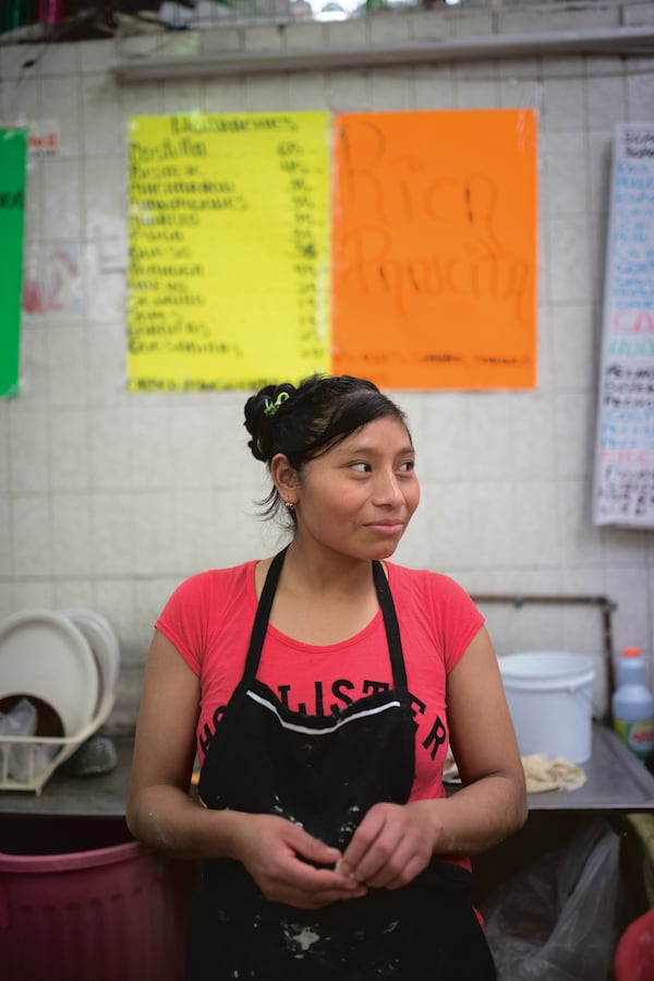 A cook at a fonda in Mexico City’s Mercado Juárez. Courtesy of Ten Speed Press/James Roper © 2020