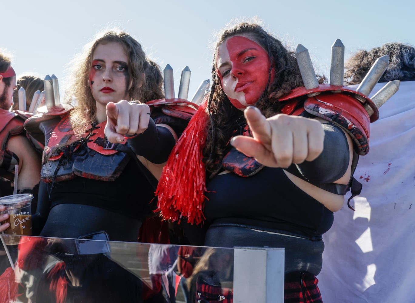 10/30/21 - Jacksonville - Spike Squad members Rachel Henderson, left, and Jessie Sutko are ready for action outside the stadium before the annual NCCA  Georgia vs Florida game at TIAA Bank Field in Jacksonville.   Bob Andres / bandres@ajc.com