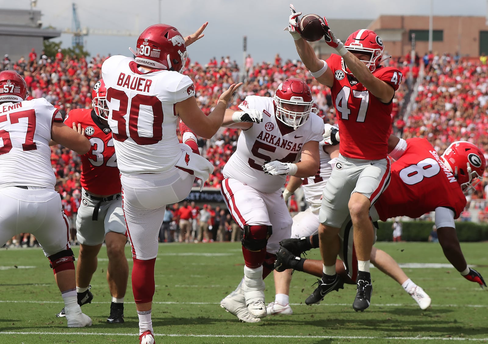 Block that kick!: Georgia's Dan Jackson blocks a punt attempt by Arkansas kicker Reid Bauer during the first quarter of Saturday's Georgia-Arkansas game in Athens. (Curtis Compton/ccompton@ajc.com)