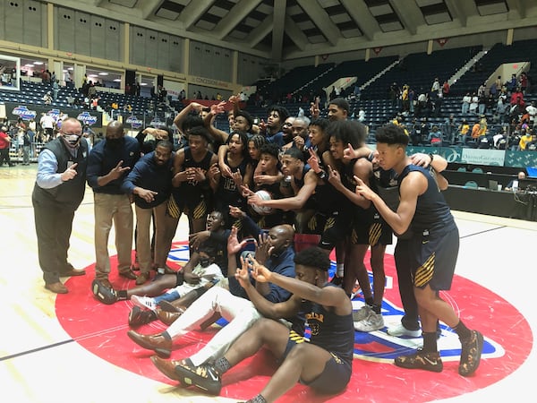 The Wheeler boys celebrate winning the 2021 Class 6A championship over rival Kell on March 12, 2021.