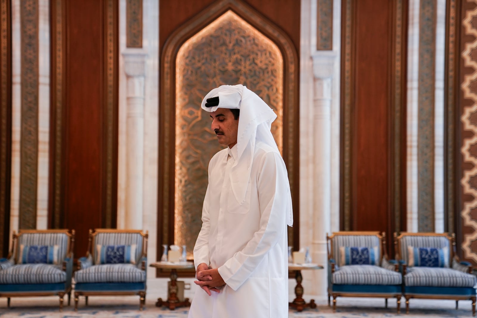 Qatar's Emir Sheikh Tamim bin Hamad al-Thani waits to receive U.S. Secretary of State Antony Blinken, in Doha, Qatar, Thursday, Oct. 24, 2024. (Nathan Howard/Pool Photo via AP)