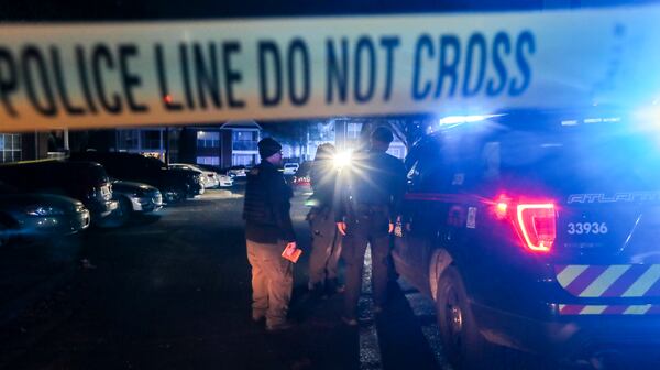 December 2, 2021 Atlanta: Atlanta police were on the scene collecting evidence and photographing a vehicle in the parking lot of The Villages at Carver located at 201 Moury Avenue SW in Atlanta on Thursday, Dec. 2, 2021. A shattered driverÕs window could be seen in the crime scene area. Atlanta police told the Atlanta Journal-Constitution that the scene stemmed from an individual walking into Grady Memorial hospital with a gunshot wound but did not provide any further details. (John Spink / John.Spink@ajc.com)

