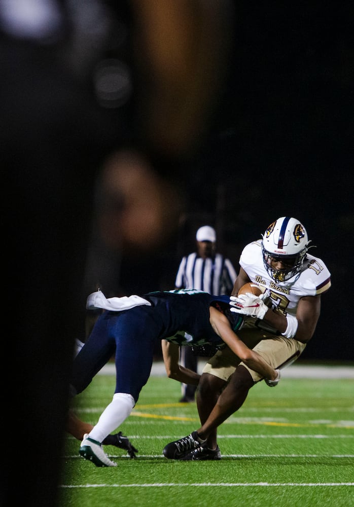 Dezmond Randolph, tight end for Pebblebrook, makes a catch and gets tackled during the Harrison vs. Pebblebrook high school football game on Friday, September 23, 2022, at Harrison high school in Kennesaw, Georgia. Pebblebrook defeated Harrison 31-14. CHRISTINA MATACOTTA FOR THE ATLANTA JOURNAL-CONSTITUTION.