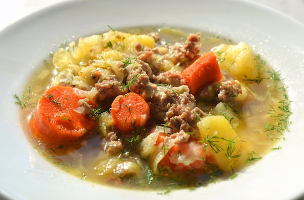 Pork sausage, cabbage, potato, carrot, and dill soup. Cabbage, an often overlooked vegetable, adds sweetness to soup, crunch to dishes and makes an incredible side dish with few ingredients. It’s packed with vitamins and there are tons of varieties. All photos taken Dec. 18, 2019, in Atlanta at the home of Jennifer Zyman. Food styling by Jennifer Zyman. (Photo by Chris Hunt Photography)