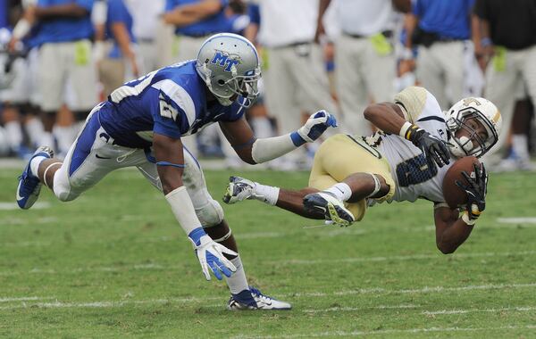 September 29, 2012 - Atlanta:  Middle Tennessee State's  Kevin Byard  (20) knocks  Georgia Tech's Tony Zenon (9)  off his feet in Bobby Dodd Stadium on Saturday, September 29, 2012.   Georgia Tech lost the game 28 to 49. JOHNNY CRAWFORD /JCRAWFORD@AJC.COM