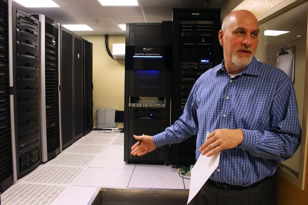 Chris Loyd, the chief information officer at Union General Hospital in Blairsville, shows the hospital’s computer room. The hospital needs fast internet for online consultations, high-quality video when physicians are remotely reviewing information, and cloud-based health information systems. That service “transforms into a better patient experience and better outcomes,” Loyd said. Jenna Eason / Jenna.Eason@coxinc.com