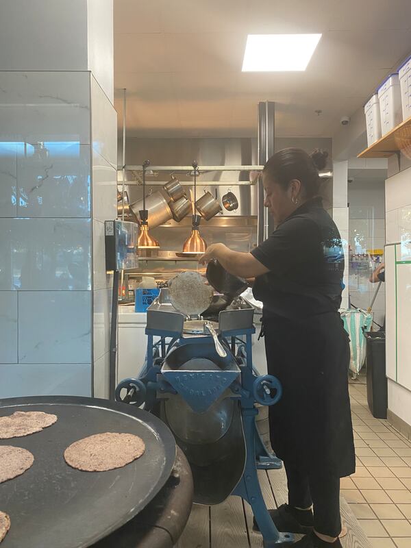 An employee prepares tortillas at D Boca N Boca in Summerhill. Yvonne Zusel/yvonne.zusel@ajc.com