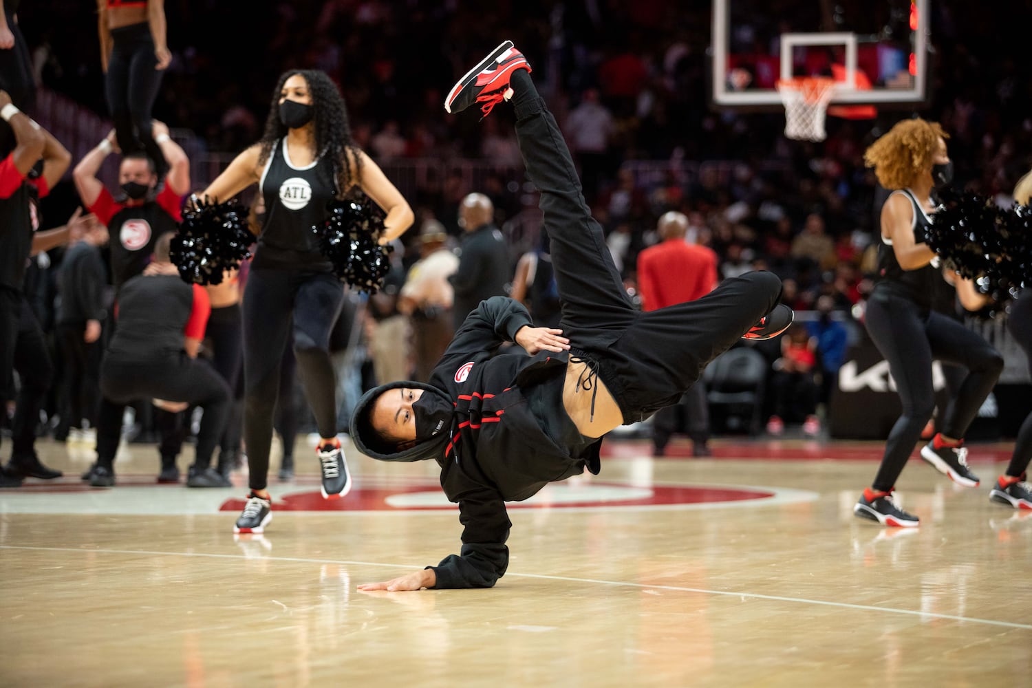 A performer breakdances during a game between the Atlanta Hawks and the Brooklyn Nets at State Farm Arena in Atlanta, GA., on Friday, December 10, 2021. (Photo/ Jenn Finch)