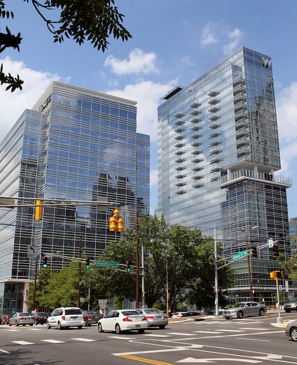 Last summer, the mixed-use W Atlanta - Downtown hotel (right) next to 55 Allen Plaza (left) was also sold at a discount to avoid a foreclosure auction. (AJC 2012)