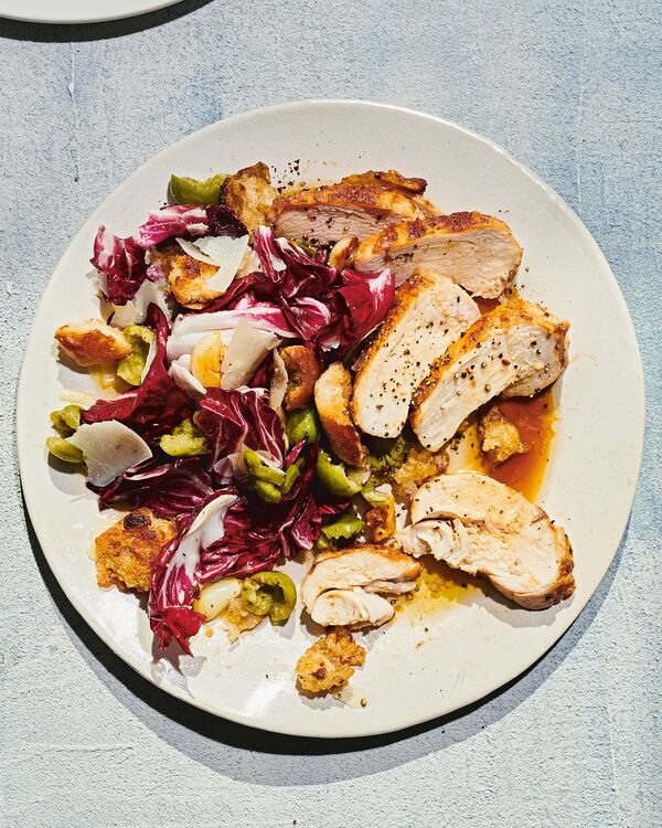 A few clever tricks ensure the juiciest, most flavorful chicken breasts ever in Golden Brown and Delicious Chicken Breasts with Crispy Bread Salad. From “Cook This Book” by Molly Baz (Potter, $32.50). (Courtesy of PEDEN+MUNK)