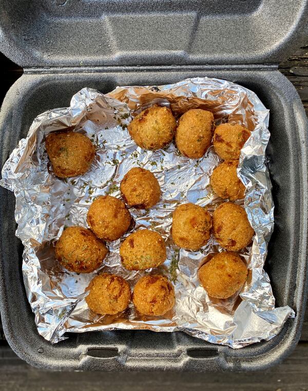 Infusion Crab ATL’s hushpuppies are a special treat.
Wendell Brock for The Atlanta Journal-Constitution