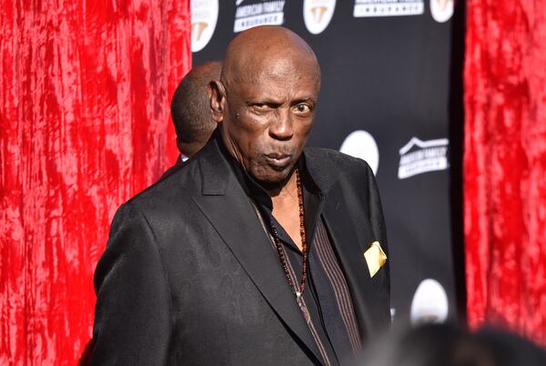 Lou Gossett Jr. poses for photographers on the red carpet before the start of the 23rd Anniversary of the Trumpet Awards at Cobb Energy Performing Arts Centre in 2015. HYOSUB SHIN / HSHIN@AJC.COM