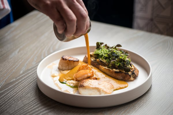 Aix Bouillabaisse with fish, Sapelo clams, Georgia white shrimp, Pei mussels, scallop, saffron broth and rouille toasts. Photo credit- Mia Yakel.