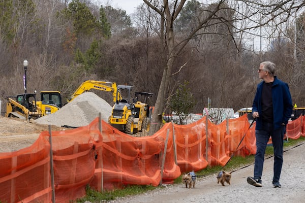 Tom Hoyt walks past construction on the Beltline at Piedmont Park in Atlanta on Thursday, Feb. 8, 2024. (Arvin Temkar/AJC)