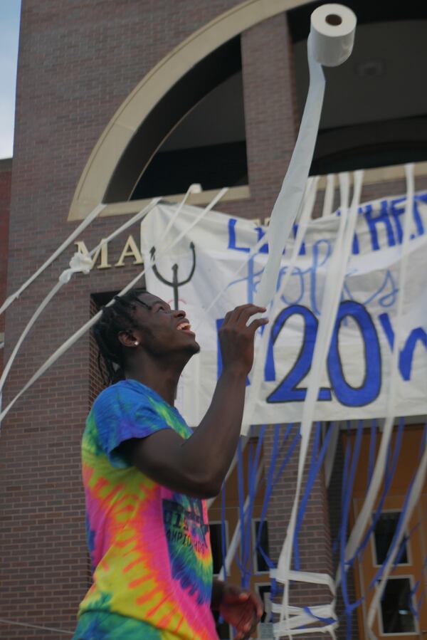 Marietta High School seniors took part in the annual toilet paper rolling the night before the start of the 2019-2020 school year. Credit: Cristain Turpin, Marietta City Schools