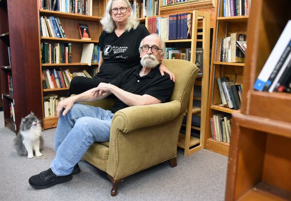 Atlanta Vintage Books owners Jan Bolgla & Bob Roarty with Big Boo the cat.