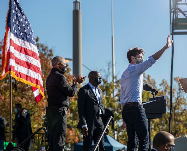 11/02/2020 —  Atlanta, Georgia — Former President Barack Obama (left) takes the stage with U.S. Democrat Senate Candidates Jon Ossoff (right) and Raphael Warnock (center) following a Biden-Harris rally in Atlanta’s Summerhill community, Monday, November 2, 2020. (Alyssa Pointer / Alyssa.Pointer@ajc.com)