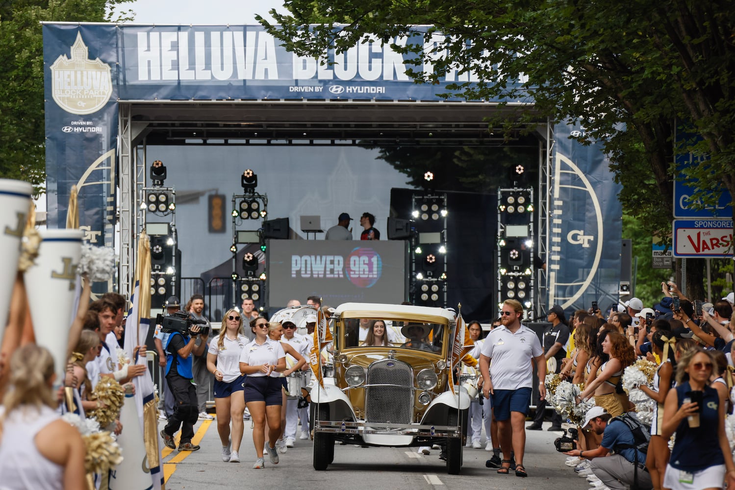 The Ramblin' Wreck makes its way down North Avenue ahead of the team.   (Bob Andres for the Atlanta Journal Constitution)