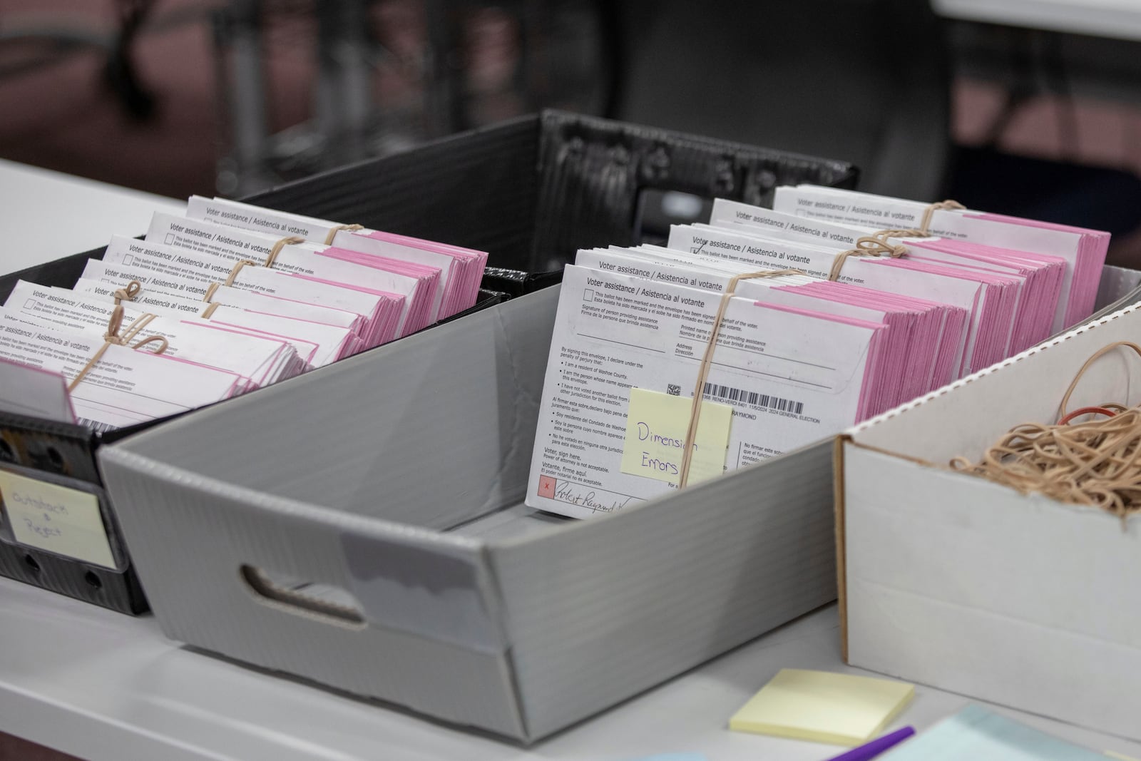 Washoe County election workers sort ballots at the Registrar of Voters Office in Reno, Nev., Tuesday, Oct. 29, 2024. (AP Photo/Tom R. Smedes)