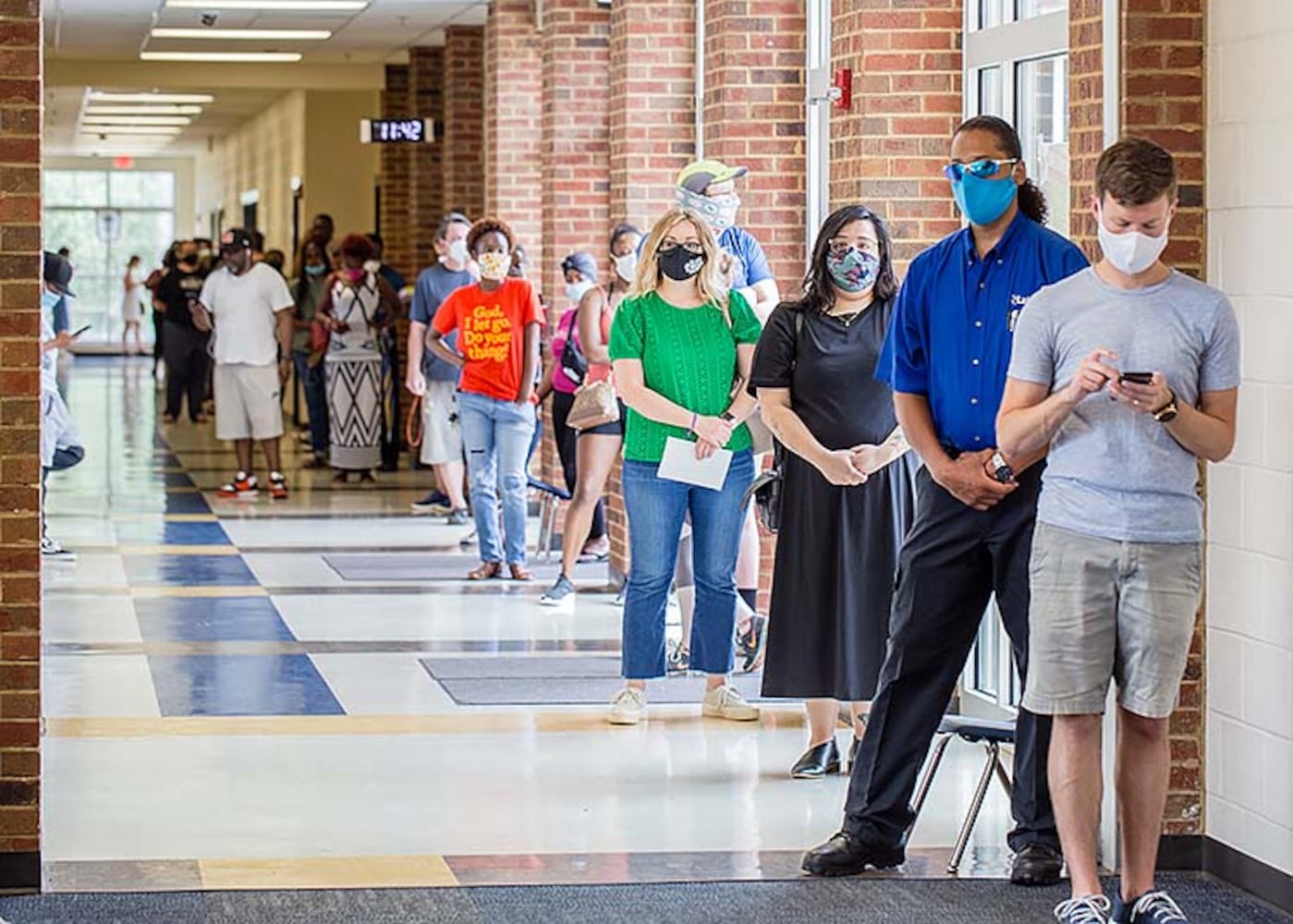 PHOTOS: Georgia voters struggle with long lines, new equipment, social distancing