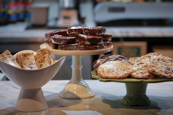 Gathering Industries makes individually wrapped sweet treats such as (left to right) power bars, brownies and cookies that are sold through wholesale customers, including Java Cats Cafe on Memorial Drive. (HaydnCorine Media)